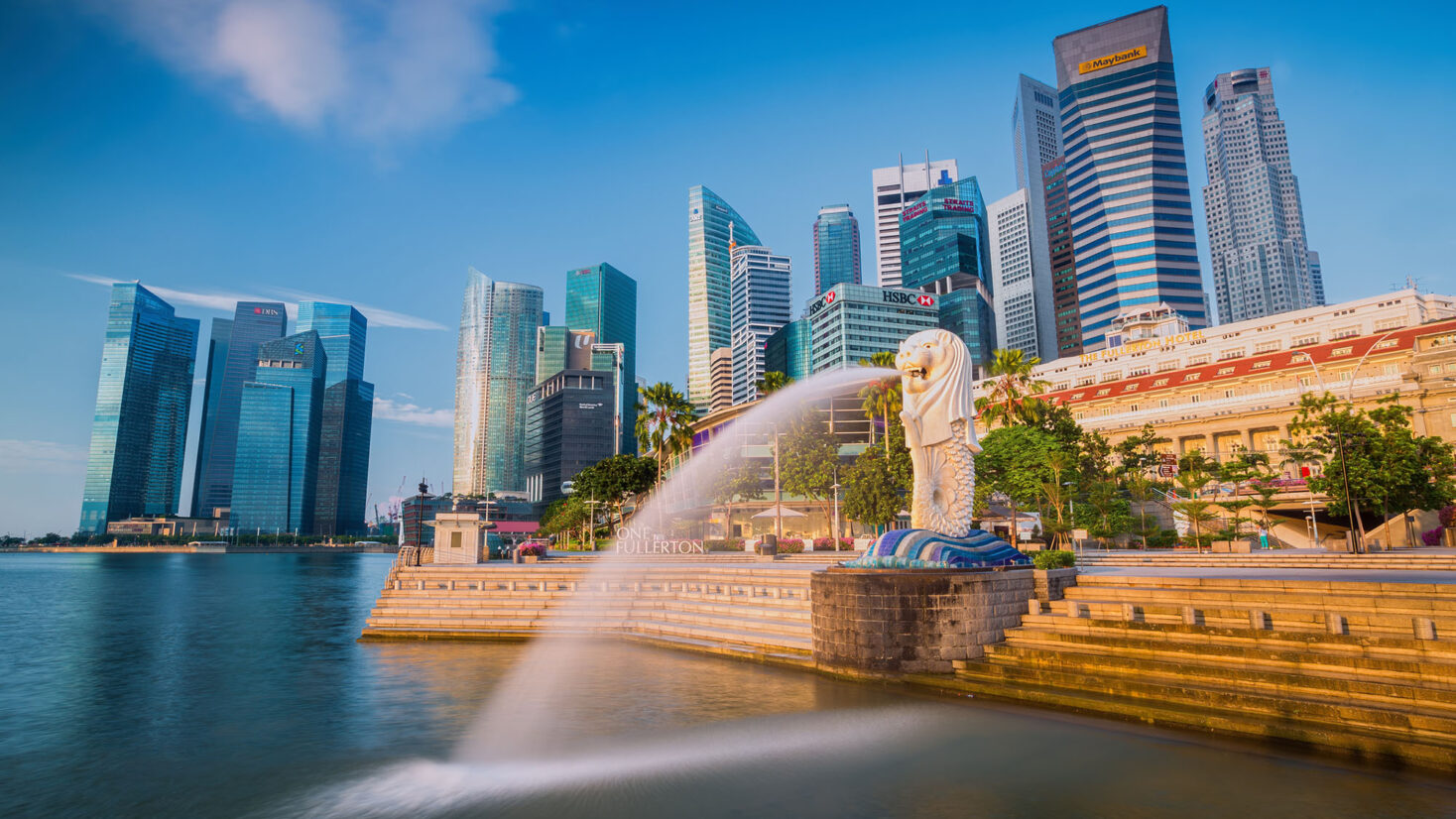 Singapore, Singapore - September 1, 2014: The Merlion fountain in front of the Marina Bay Sands hotel on September 01, 2014 in Singapore. Merlion is a imaginary creature with the head of a lion, seen as a symbol of Singapore